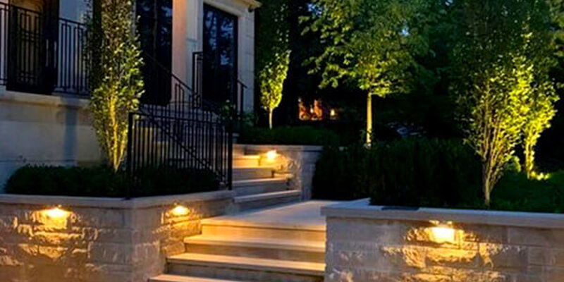 home with beautiful landscape lighting